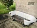 An old Cast Iron Bathtub turned into an outdoor couch.