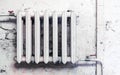 Old cast-iron heating radiator in grunge style Royalty Free Stock Photo