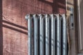 Old cast-iron heating radiator in grunge style. Winter house heating concept. Royalty Free Stock Photo