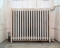 Old, cast iron radiator in abandoned house. Royalty Free Stock Photo