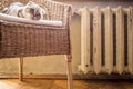 Old cast iron radiator and heating cat Royalty Free Stock Photo