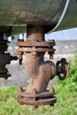 Old cast iron valve on the pipeline Royalty Free Stock Photo