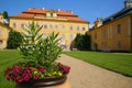 Old castle in Central Europe with a red roof and blue sky on a beautiful summer day. Tourist attraction of old Europe. Castle Royalty Free Stock Photo