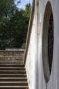 Old castle staircase with round barred window Royalty Free Stock Photo