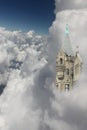 Castle Tower with Windows in the Clouds Royalty Free Stock Photo