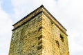 Old castle tower wall with sky on background in uk Royalty Free Stock Photo