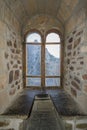 Old castle window overlooking the fortress Royalty Free Stock Photo