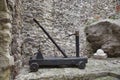 Old catapult with stones as old weapon