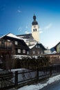 Old catholic church at Austrian village covered by snow Royalty Free Stock Photo