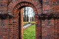 Old Catholic Church red brick gates in city Akniste, Latvia. Closeup Royalty Free Stock Photo