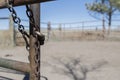 Old Cattle Pen. Iron Chain & Lock on Open Gate Royalty Free Stock Photo