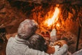 Old caucasian couple spending leisure time together at home. Back of romantic senior husband embracing with wife while relaxing Royalty Free Stock Photo