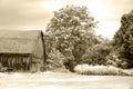 Old cedar sided country barn with carriage Sepia Royalty Free Stock Photo