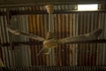The old ceiling fan hung on the beam. Royalty Free Stock Photo