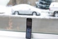 Old cell phone with car in snow Royalty Free Stock Photo