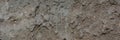 Old cement plaster with traces of destruction. Web banner