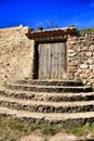 Old cemetary wooden door with wrought iron details Royalty Free Stock Photo