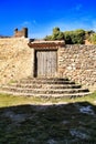 Old cemetary wooden door with wrought iron details Royalty Free Stock Photo