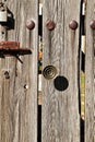 Old cemetary wooden door with wrought iron details Royalty Free Stock Photo