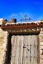 Old cemetary wooden door with wrought iron details Royalty Free Stock Photo