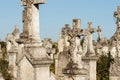 Old cemetery. Ancient abandoned graves with statues, overgrown with moss and lichens Royalty Free Stock Photo
