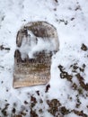 Old cemetery gravestones with snow