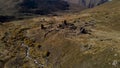 Old cemetery with ruins of ancient tombs located in mountains. Footage. Aerial view of the ancient burial place with