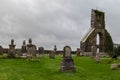 Old cemetery and ruins in a beautiful rural landscape with green grass. Irish landscape