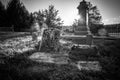 Old cemetery and tombstones in rural town, black and white Royalty Free Stock Photo