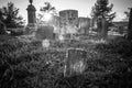 Old cemetery and tombstones in rural town, black and white Royalty Free Stock Photo