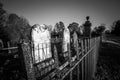 Old cemetery and tombstones in rural town, black and white Royalty Free Stock Photo