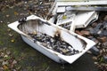 Old ceramic bath from demolition of derelict house on construction building site Royalty Free Stock Photo