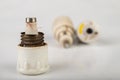 Old ceramic electric fuse. Blown and badly repaired security for energy Royalty Free Stock Photo