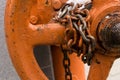 Old chain painted winded with chipped links twist the valve most of the industrial background base closed locked circle on a blurr Royalty Free Stock Photo