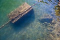 Old chain under water, concrete block sank
