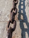 Old chain on wall at docks Royalty Free Stock Photo