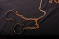 Old chains or handcuffs used to hold prisoners or slaves