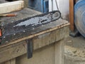 old chainsaw in a factory Royalty Free Stock Photo