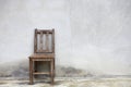 Old chair against old wall Royalty Free Stock Photo