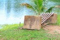 Old chair deduct riverside in public park Royalty Free Stock Photo