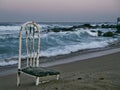 Old chair on a deserted beach