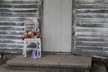 Old chair with flowers and purple shoes Royalty Free Stock Photo