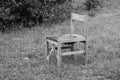 Old chair on the grass, black and white photo Royalty Free Stock Photo