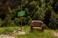 Chair next to the traffic sign Royalty Free Stock Photo