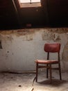 Old chair in rustic vintage style attic. Horror background concept Royalty Free Stock Photo