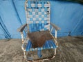 old chairs, starting to break down and the color is fading, made of metal plates and a mixture of wood