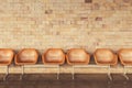 Old chairs with yellow brick wall background. Royalty Free Stock Photo