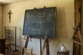 Old chalkboard standing in an old school Royalty Free Stock Photo