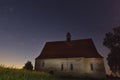 Old chapel in the village of Dobronice, under the night sky. Royalty Free Stock Photo