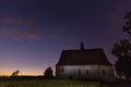 Old chapel in the village of Dobronice, under the night sky. Royalty Free Stock Photo